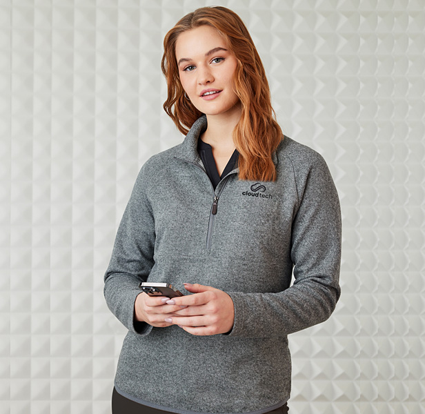 woman wearing gray half-zip