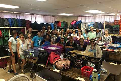 Axis Promotions’ Larry Alford Distributes Promo-Filled Backpacks To Migrant Children