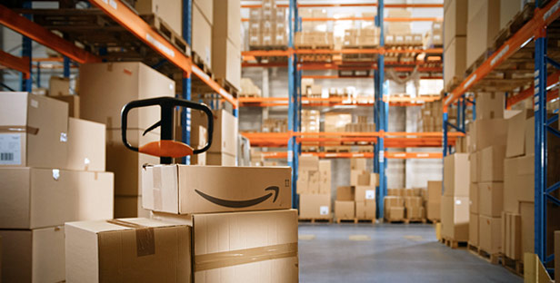 Amazon boxes stacked in warehouse