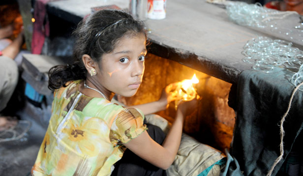 Bangladeshi child working with fire