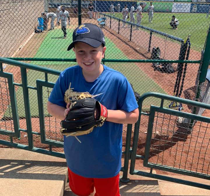 My son Dylan outside the away team’s bullpen, sporting the Trenton Thunder hat he’d just purchased in the team store.