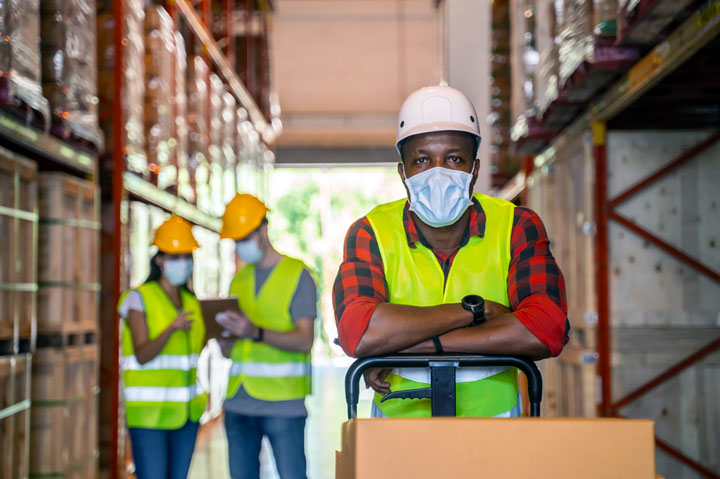 warehouse workers wearing masks