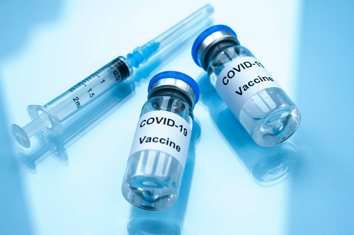 Covid-19 vaccine vials and syringe