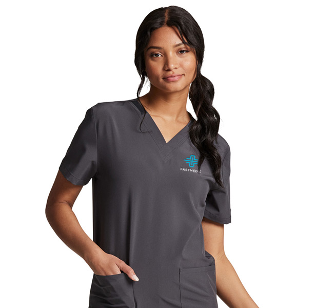 woman wearing dark gray scrub shirt