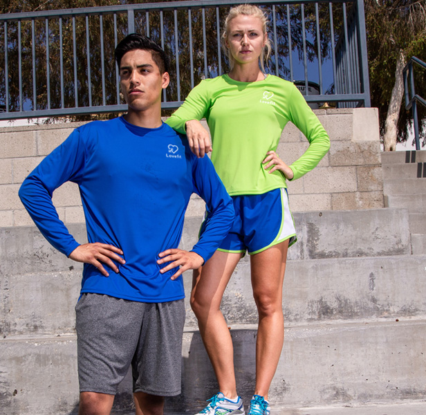 man and woman wearing long sleeve performance shirts