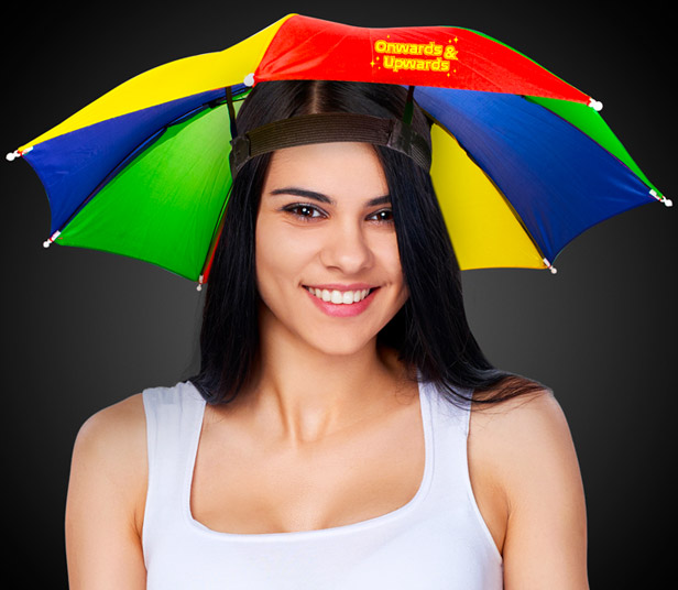 smiling dark-haired woman wearing multicolor umbrella hat