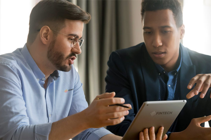 businessman talking while looking at ipad