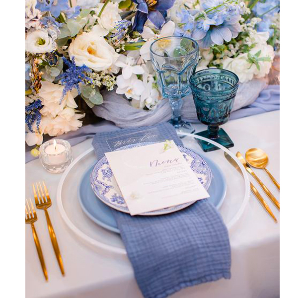 blue-themed table scape, place setting and flowers