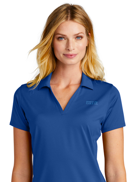 blond woman in blue polo shirt