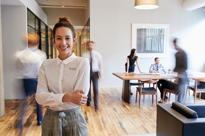 young woman smiling in office setting