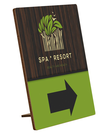wooden sign with kickstand, resort spa logo and arrow