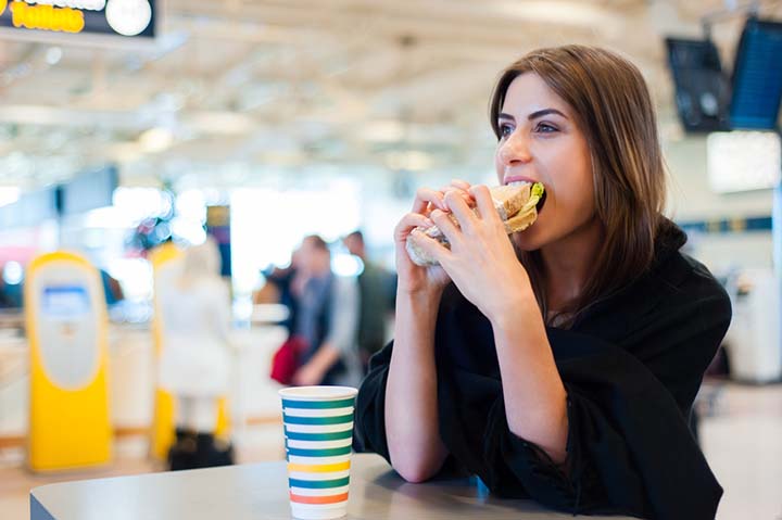 Young woman eating a sandwich