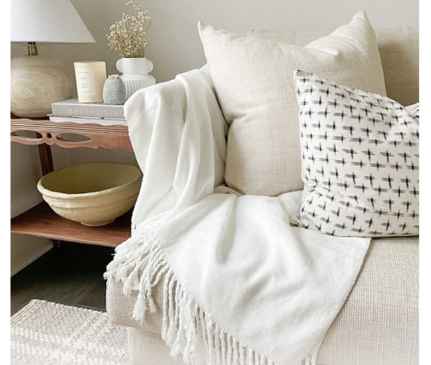 white bamboo blanket on sofa