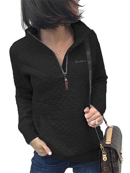 woman wearing black quarter-zip