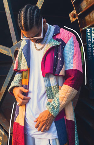 man wearing colorful patchwork quilted jacket