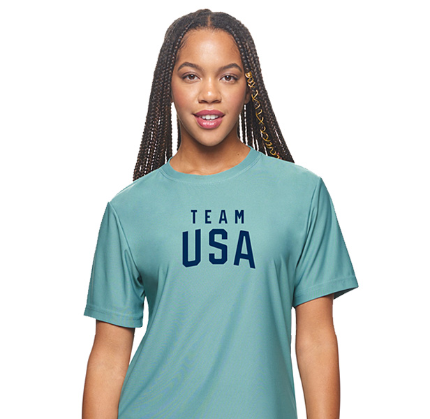 woman wearing green t-shirt featuring Team USA logo