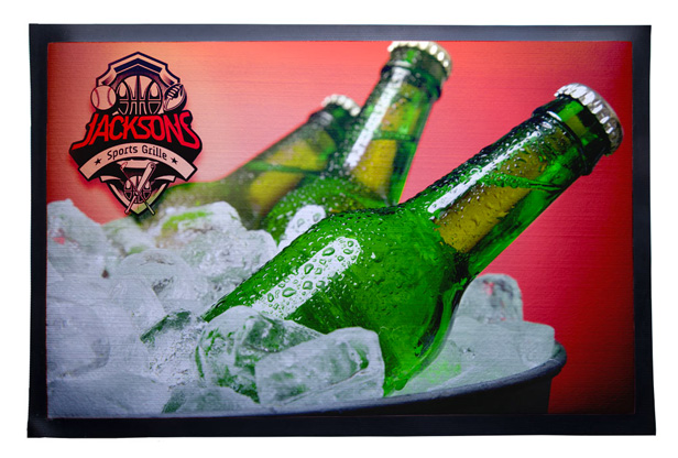 counter mat showing green beverage bottles in ice bucket