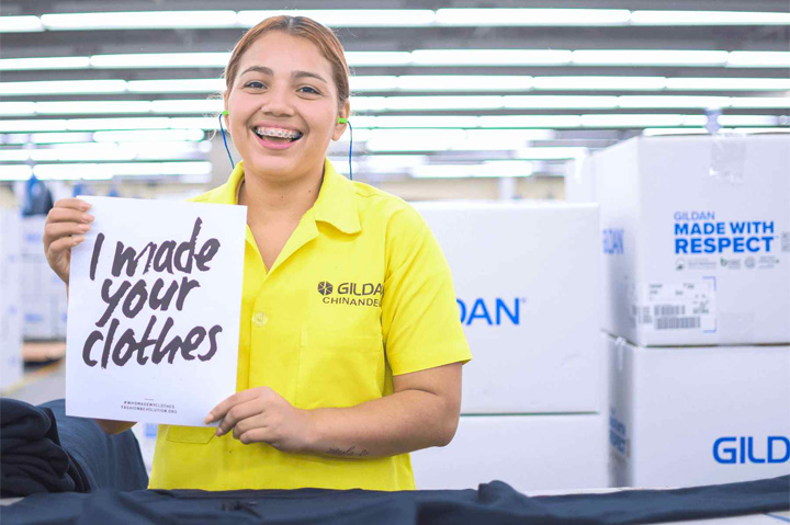 Gildan employee holding sign