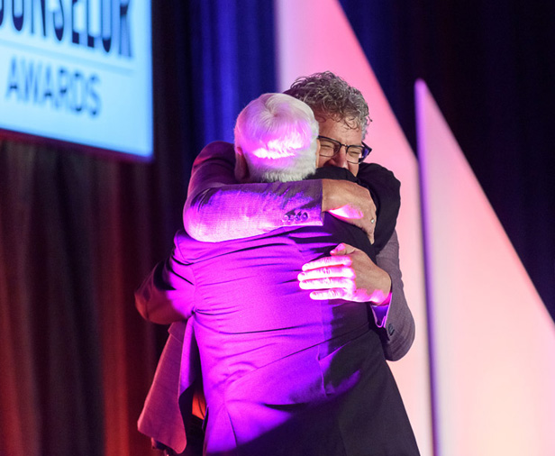 Steve Levschuk embracing Fred Oesen