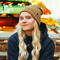 young blonde woman wearing stocking cap