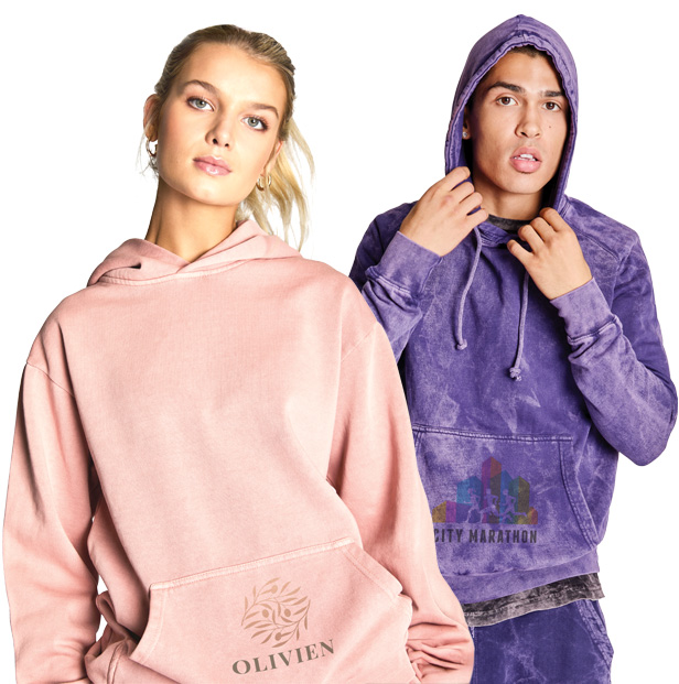 young female and male wearing colorful sweatshirts