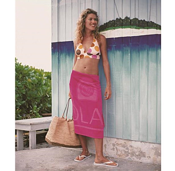 woman wrapped in pink beach towel