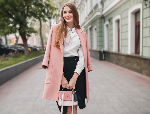 blush pink girl on city sidewalk