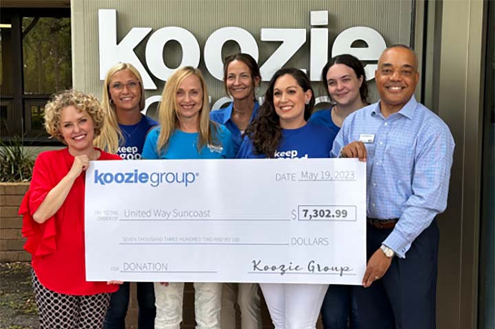 Representatives from Koozie Group’s headquarters in Clearwater, FL, present a donation check to Kari Goetz and Scott Morrison from United Way Suncoast.