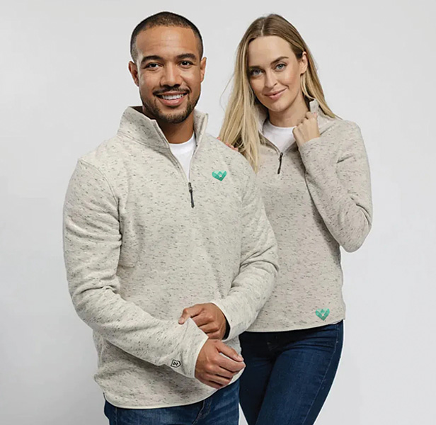 man and woman wearing 1/4 zip fleece shirts