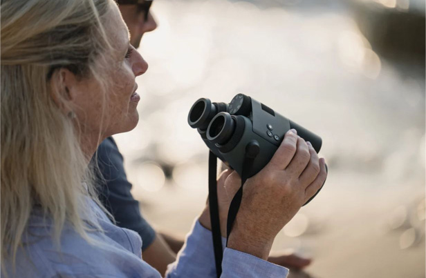 woman holding binoculars