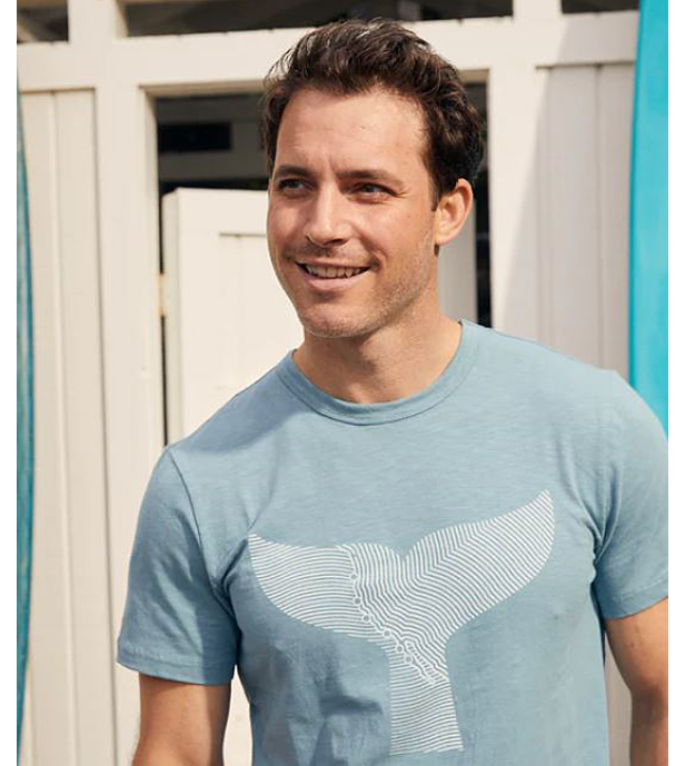 man wearing gray whale t-shirt