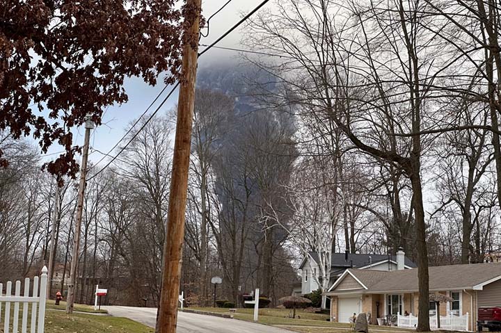 A smoke cloud rises after authorities released chemicals from a train derailment in East Palestine, OH, earlier this year.