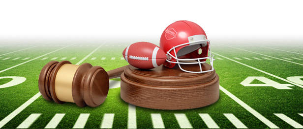 football, helmet and gavel on football field