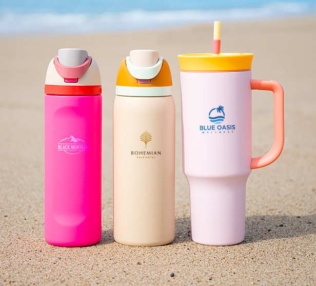 colorful drinkware on sandy beach